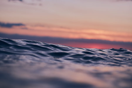 blue wave against red evening sky