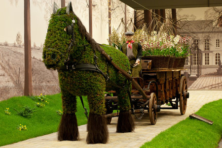 GHENT, BELGIUM - APRIL 23: The Ghent Floralies (de Gentse Floralien ) 34th edition of prestigious flower and plant exhibitions on April 17-25. April 23, 2010 in Ghent (Gent), Belgium. Horse and carriageのeditorial素材