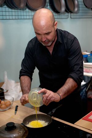 Brussels, BELGIUM - MARCH 16, 2019: Cake design and pastry fair - Cake and Sugar Brussels, 2019. Master-class of exhibitor Akarsenty, testing new titan DanRoc pan.のeditorial素材