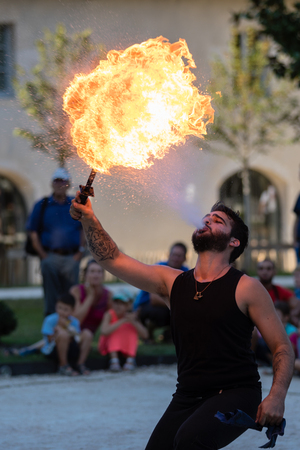 Sassenage castle, Isere, France - September 15 2018 : European Heritage Day, Young fire breather spitting flames.のeditorial素材