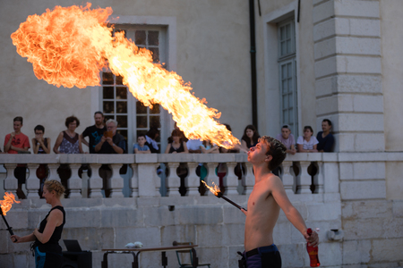Sassenage castle, Isere, France - September 15 2018 : European Heritage Day, Young fire breather spitting flames.のeditorial素材