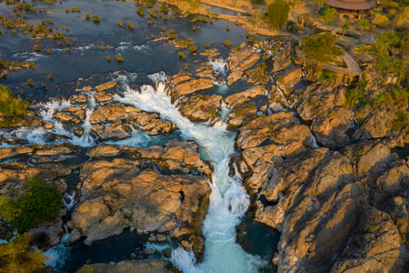 High-angle perspective captures Tat Somphamit Waterfalls, also known as Li Phi Falls, in Champasak...