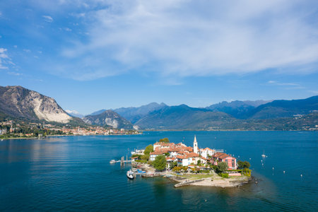 Aerial view of Isola dei Pescatori with its terracotta rooftops, church tower, and waterfront set...