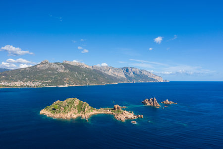 Aerial landscape featuring Isola dellOgliastra with jagged rocky outcrops and lush greenery,...
