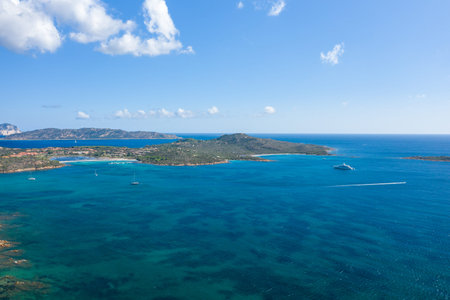 Aerial view of Spiaggia Salina Bamba near San Teodoro, Sardinia, showing vivid turquoise waters,...