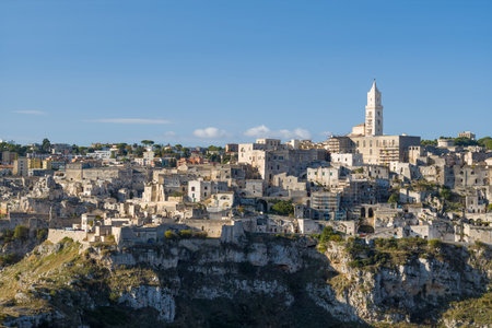 Distinctive skyline of Matera, Italy, featuring clustered ancient stone buildings and a prominent...