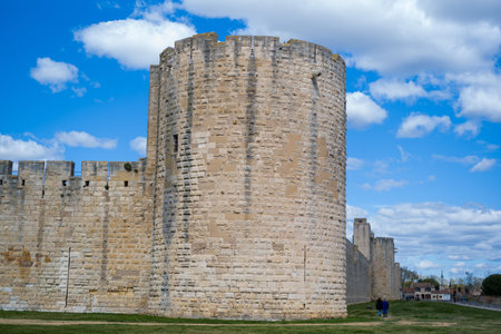 Unknown location - April 2, 2023: The Tour de la Poudriere, a large round medieval stone tower, and...