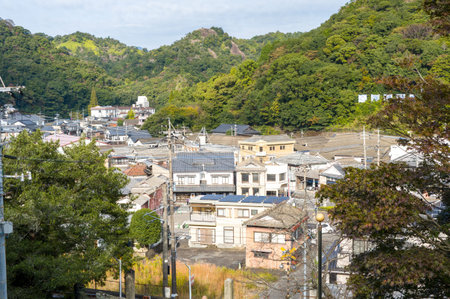 Arita, Japan - November 9, 2024: The image shows a view over the town of Arita with residential...