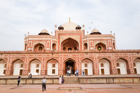 Delhi, India - March 30, 2024: The image shows people standing, walking, and sitting near the main...