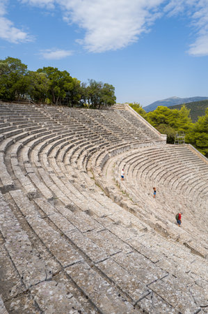 Epidaurus, Greece - September 2, 2024: The ancient semicircular stone theater at the Sanctuary of...