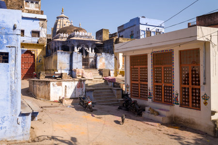 Bundi, India - March 19, 2022: A Hindu temple with a domed roof is seen at the end of a narrow alley...