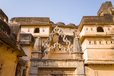 Bundi, India - March 20, 2022: The image shows an intricately carved stone gateway with decorative spires and surrounding palace walls inside the inner enclosure of Garh Palace under a clear sky.のeditorial素材