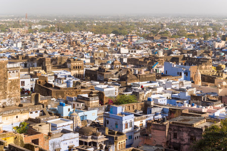 Bundi, India - March 20, 2022: The image shows an elevated view of the densely built old town area with historic stone buildings, blue-painted houses, domes, and narrow streets extending into the distance under daylight.のeditorial素材