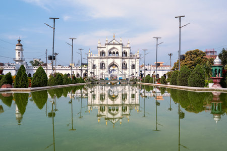 Lucknow, India - March 16, 2024: The image shows the Chota Imambara mausoleum with white domes and...