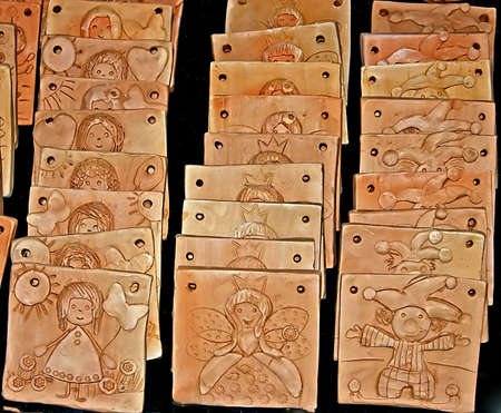 Different types of clay, with relief designs, ready to be colored by children at a workshop  Timisoara, Romania の写真素材