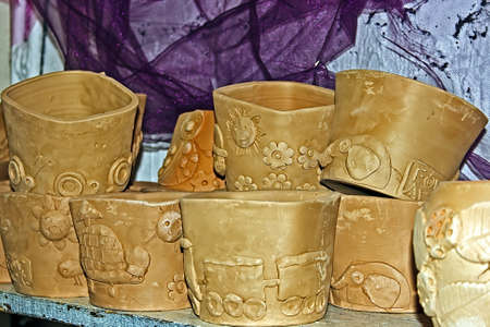 Different types of clay, with relief designs, ready to be colored by children at a workshop  Timisoara, Romania の写真素材