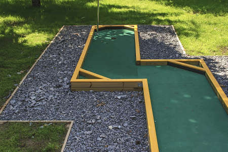Small golf course built for children in a recreational space の写真素材