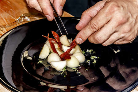 Arrangement cooking with different varieties of fish and fruitの写真素材