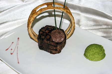 Arrangement cooking with different varieties of meat, sweets, bakery and ice cream の写真素材