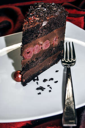 Slice of chocolate cake served on a plateの写真素材