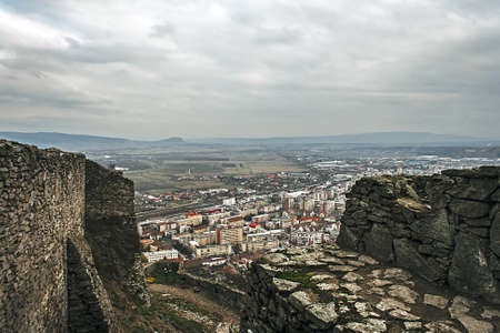 Aerial view of the city of Deva, Romania, from the ruins of a citadel built in 1250 and located at an altitude of 371 meters above the city の写真素材