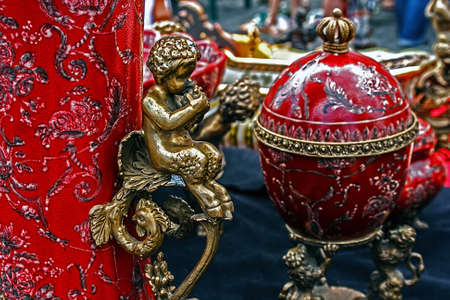 Old ceramic pots with added metal figurines の写真素材
