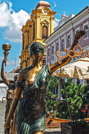 Old bronze statues representing justice and democracyの写真素材