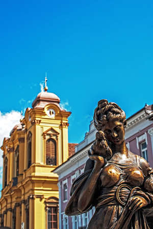 Old bronze statue on display at an exhibition of vintage in Unirii Square of Timisoara, Romania  In the background is German Domeの写真素材
