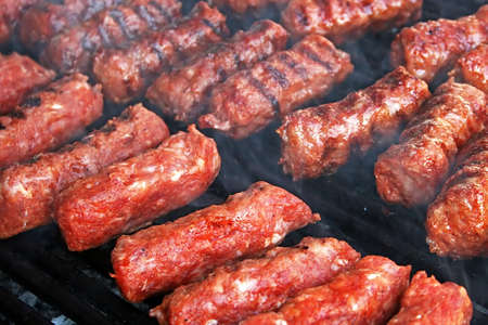Romanian traditional sausages fried on the grillの写真素材