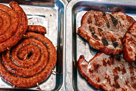 Toasted ham and fried sausages rolled, secure with wooden rodsの写真素材