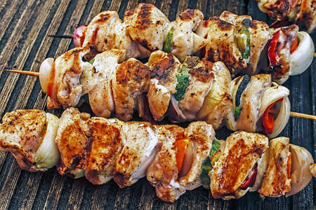 Grilled skewers of meat and vegetables compositionsの写真素材