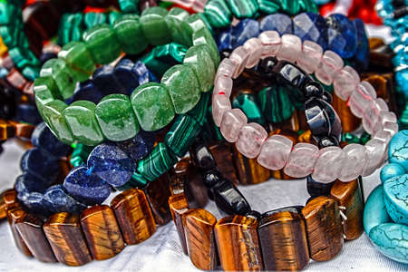 Different colored trinkets displayed in the waiting customers の写真素材