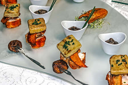 Arrangement cooking with different varieties of fish and fruits の写真素材