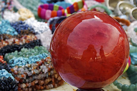 Globe glass, trinkets, bracelets and colorful jewelryのeditorial素材