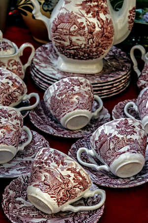Old ceramic cups with red paintings applied の写真素材