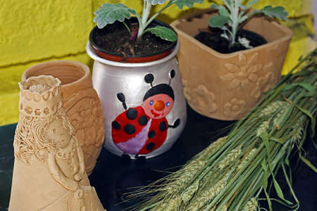 Different types of clay colored children at a workshop の写真素材