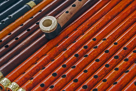 Whistles made from different types of wood and colored の写真素材
