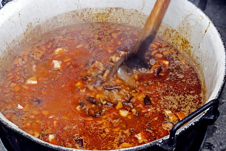 Gulas soup prepared in a large pot, at a fair with traditional food  Specific for Transylvania,...