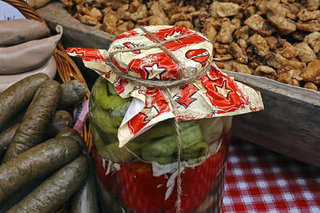Traditional pickles, cracklings and sausages, placed on a table の写真素材