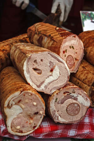 Traditional sausages, cut to be served and placed on a table の写真素材