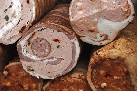 Traditional sausages, cut to be served and placed on a table 