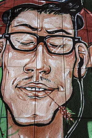 Portrait drawing graffiti on a street wall の写真素材