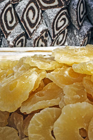 Salami with white and brown chocolate, together with dried pineapple slices  Homemade sweets の写真素材