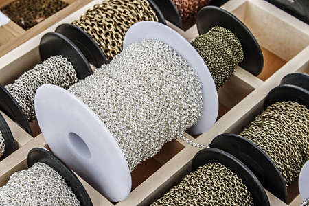 Spools with colored chains for made trinkets の写真素材