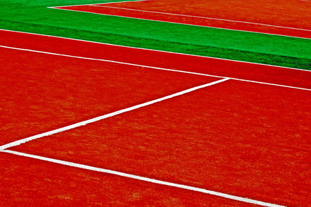 Sports field with synthetic turf and different markings, used in sports 