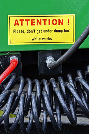 Part from one equipment for agriculture, with warning sign, presented to an agricultural exhibition の写真素材