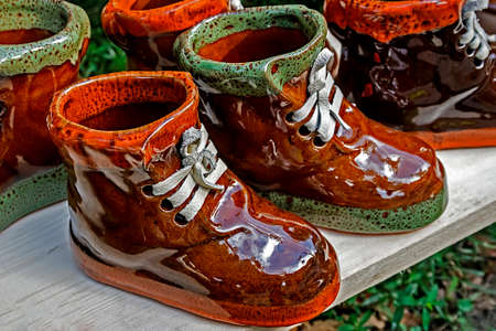 Boots ornamental from ceramics, made in house and exposed for sale  Specific on Corund area, Transylvania, Romania の写真素材