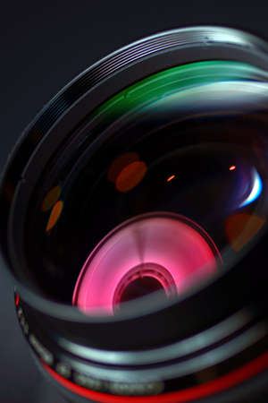 Professional photo lens closeup with colorful reflections の写真素材
