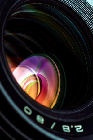 Professional photo lens closeup with colorful reflections の写真素材