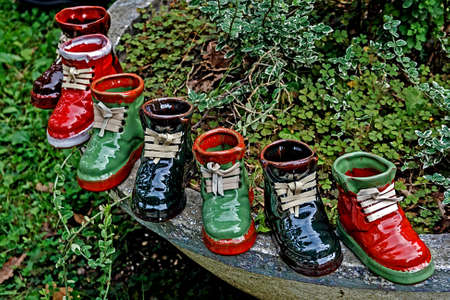 Boots ornamental from ceramics, made in house and exposed for sale. の写真素材